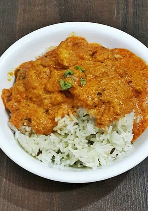 A picture of Butter Chicken With Jeera Rice.