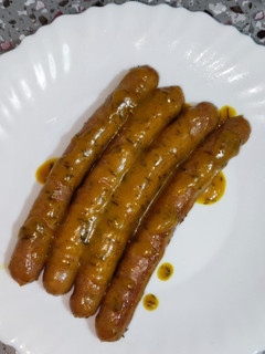 Una foto de Salchichas con salsa de naranja