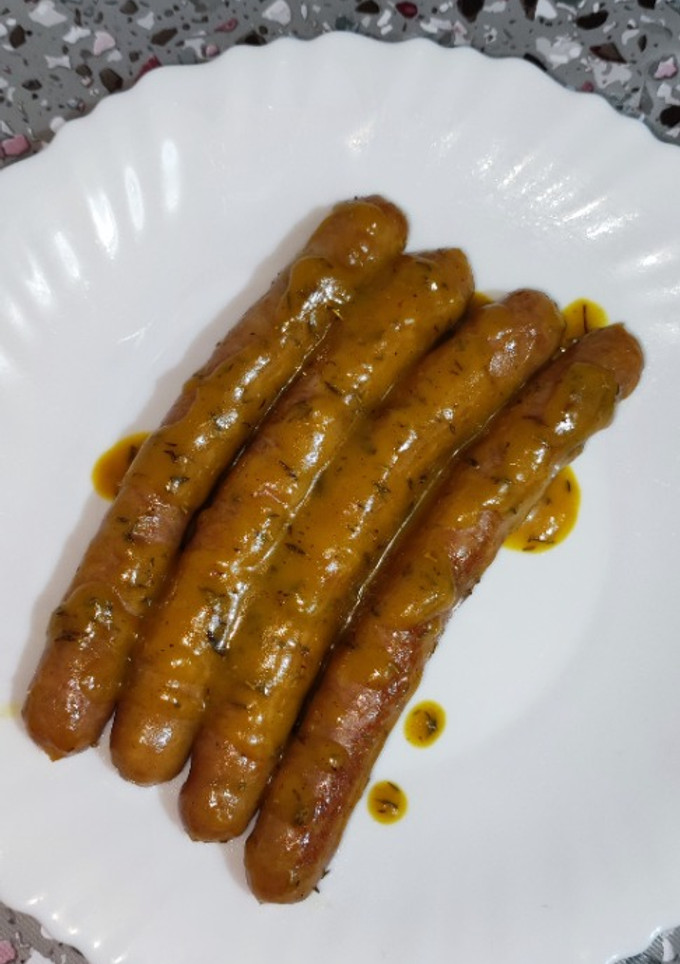 Una foto de Salchichas con salsa de naranja