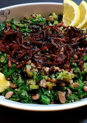 A picture of Swiss Chard with black eyed peas.