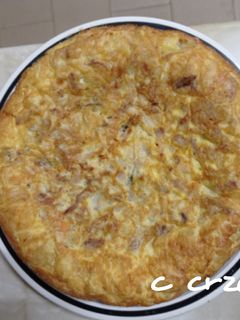 Una foto de Tortilla con carne de esqueleto de pollo