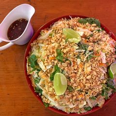 A picture of Vietnamese cabbage salad with tofu, rice vermicelli and peanuts.