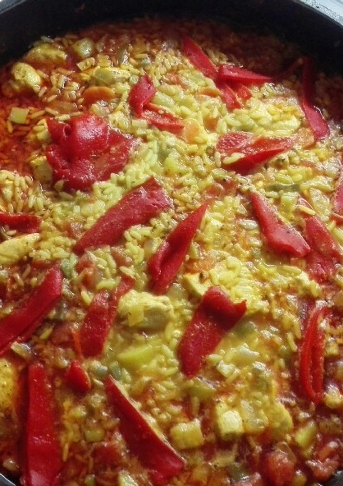 Una foto de Pollo con arroz caldoso