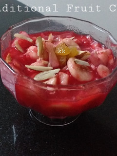 A picture of Traditional fruit chat with laal chutney dipping.