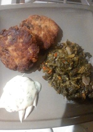 A picture of Fried Fresh Salmon w/kale & dandelion greens.