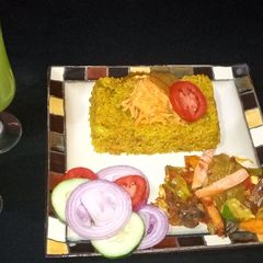 A picture of Fried rice with vegetable source and cucumber juice.
