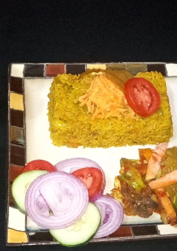 A picture of Fried rice with vegetable source and cucumber juice.