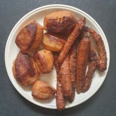 A picture of Slow Roasted Potatoes and Carrots.