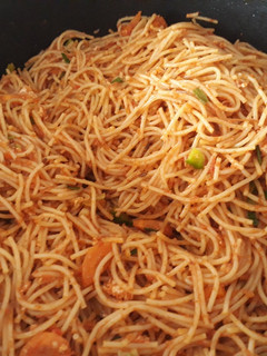 A picture of Spaghetti with vegetables.