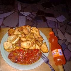 Fried potatoes with tomatoes sauce A picture of Fried potatoes with tomatoes sauce.