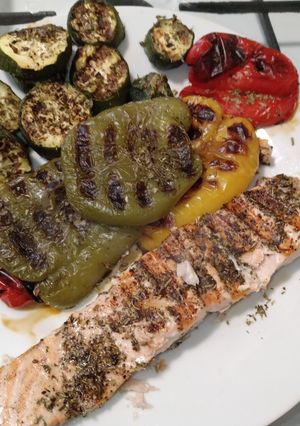 A picture of Grilled Salmon Fillets with Peppers and Courgette.