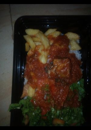A picture of Rice & stew, with fried irish.