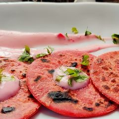 A picture of Beetroot chapati with beetroot dip.