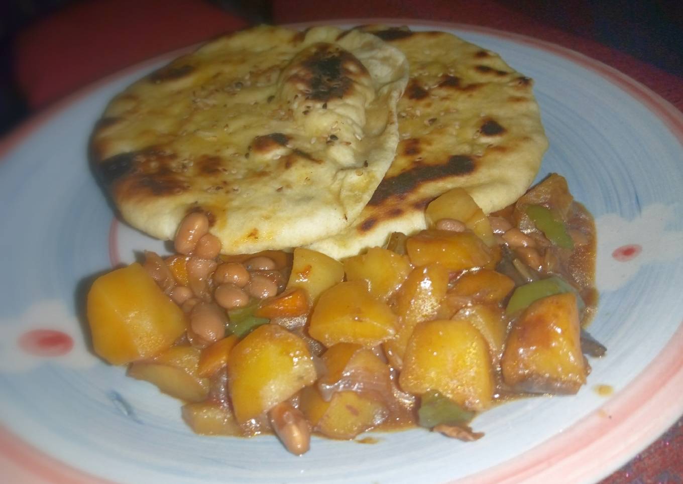 Naan bread nd potatoe with baked beans sauce