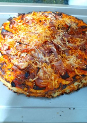 Una foto de Pizza con base coliflor