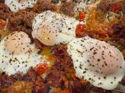 A picture of egg bacon hash browns