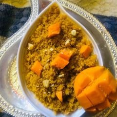 A picture of Semolina Mango Prasad Sheera.