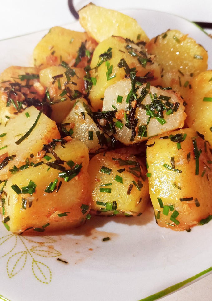 Una foto de Papas al ajillo