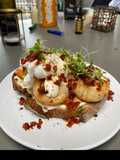 Scallops, nduja & poached duck eggs on sourdough with a mustard creme fraiche