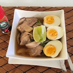 A picture of Noodle Egg With Shiitakes Soup.