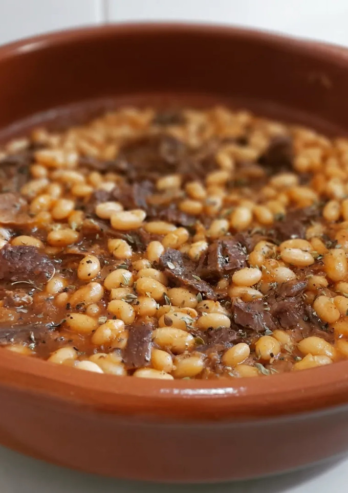 Una foto de Fessolets con ternera estofada y ceps