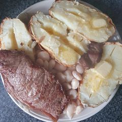 A picture of Sirloin Beef steak Jackets an Butter Beans.