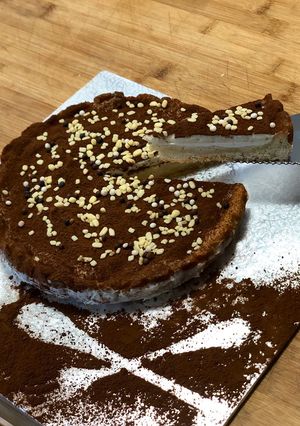 A picture of Tart with Panna Cotta, White Chocolate Namelaka Cream, and Cocoa.