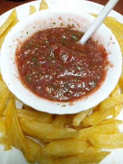A picture of Fries, crisps dip.