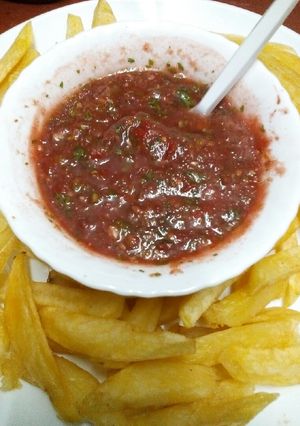 A picture of Fries, crisps dip.