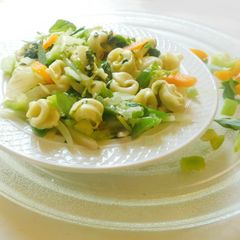 A picture of Tortellini Pasta with white sauce.