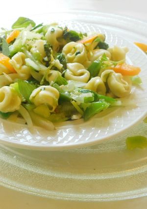 A picture of Tortellini Pasta with white sauce.