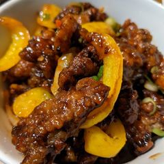 A picture of Crispy sweet Chilli Beef and rice.