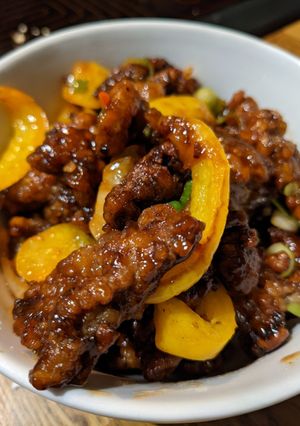A picture of Crispy sweet Chilli Beef and rice.