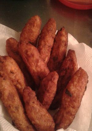 Una foto de Palitos con sobrante de arroz y frijoles