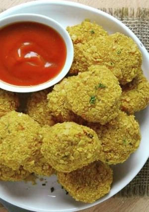 Una foto de Nuggets de pollo rebozado con copos de cereal