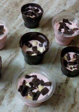 A picture of Chocolate cups and Strawberry Mousse.