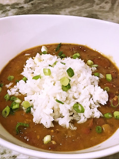 A picture of Red beans and rice with smoked sausage.