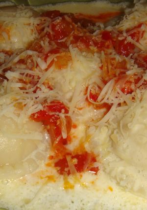 Una foto de Sorrentinos de ricota, mozzarella y jamón