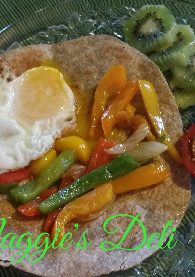 Una foto de Huevo y pimientos fritos