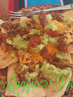 Una foto de Nachos con chilorio