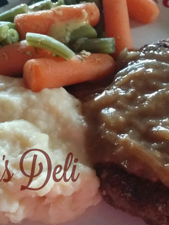 Una foto de Carne de hamburguesa con gravy de Cebolla