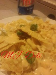 Una foto de Dip de queso cheddar, queso crema y cerveza