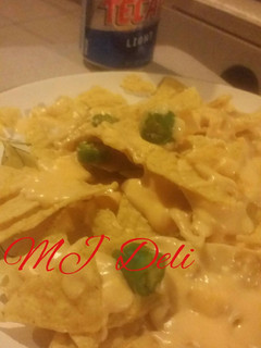 Una foto de Dip de queso cheddar, queso crema y cerveza