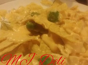 Una foto de Dip de queso cheddar, queso crema y cerveza