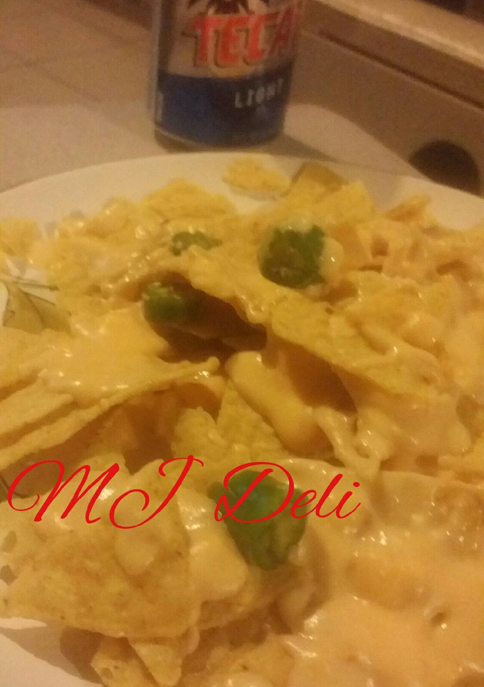 Una foto de Dip de queso cheddar, queso crema y cerveza