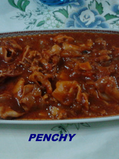 Foto principal de Calamares en salsa con su tinta al Fino de Moriles