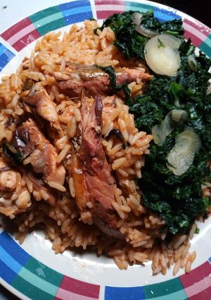 A picture of Smoked fish jollof Rice and Vegetables.