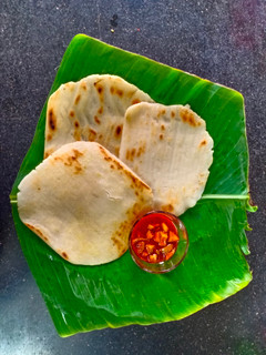 केळीच्या पानातील भाकरी (पानगी) (bhakri recipe in marathi) रेसिपी चे मुख्य फोटो