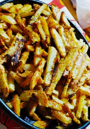 Una foto de Papas rústicas saborizadas al horno