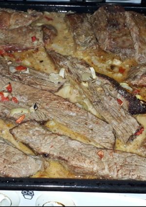 Una foto de Carne al horno con Leche